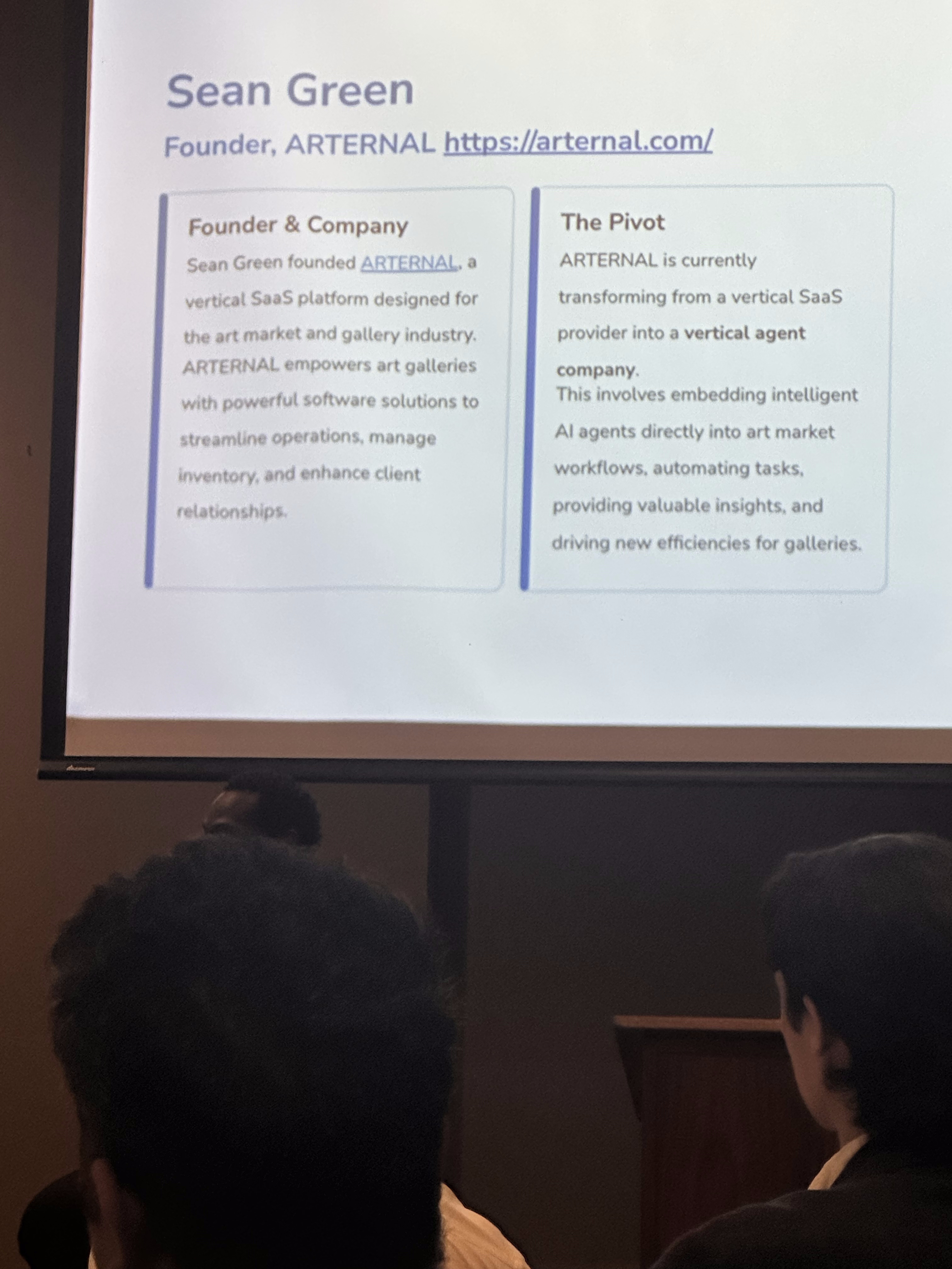 Elio Narciso, founder of Scalestack, on the panel with John Eng. The Scalestack 'Agentic Bet' slide is visible behind them.